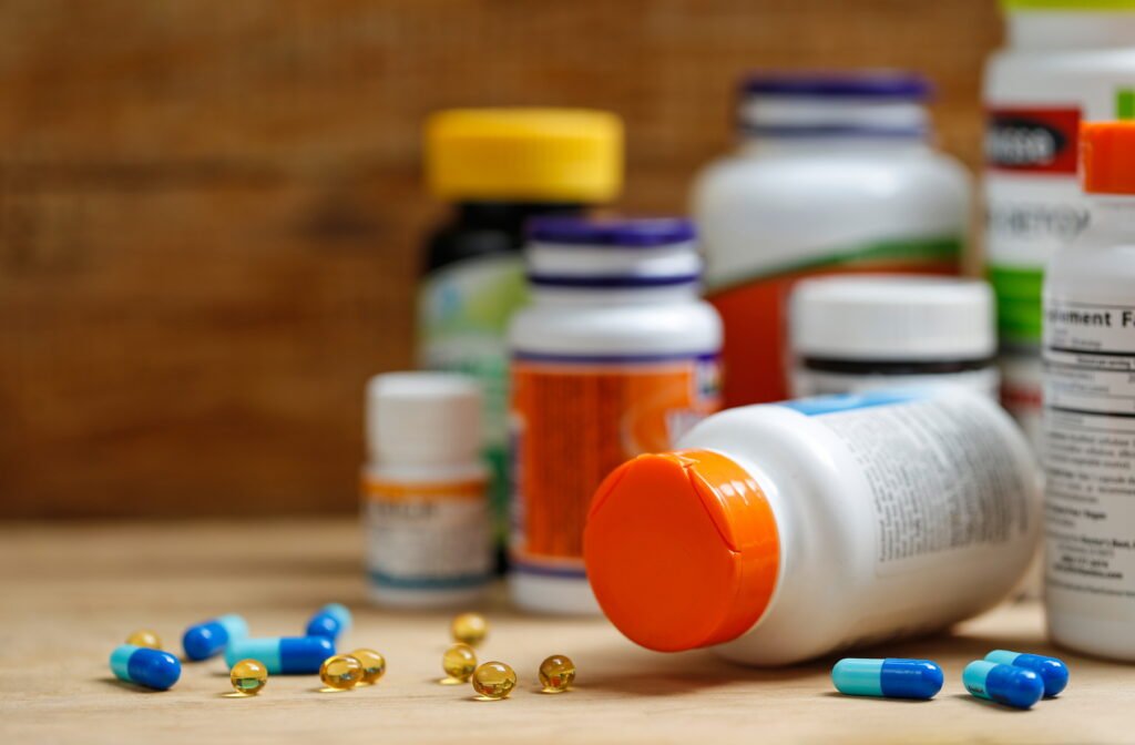 Ella Olla Vitamin bottle and supplements on a table