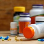Ella Olla Vitamin bottle and supplements on a table
